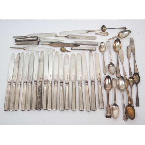 261 - A set of thirteen silver dessert knives