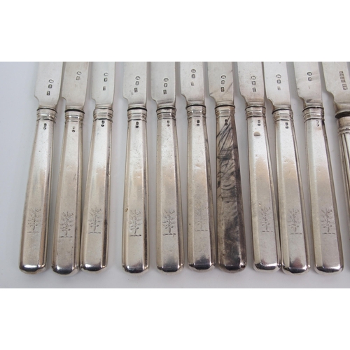 261 - A set of thirteen silver dessert knives