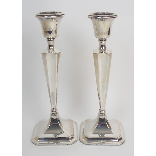 272 - A pair of silver candlesticks