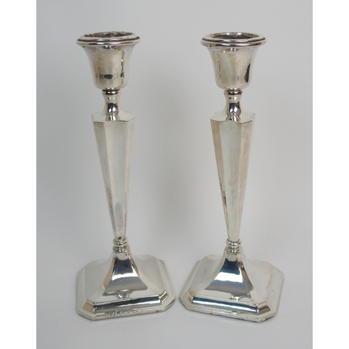 272 - A pair of silver candlesticks