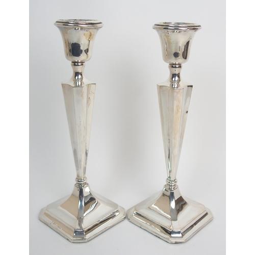 272 - A pair of silver candlesticks