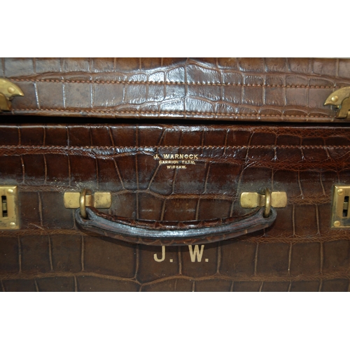 383 - Two brown leather animal skin suitcases