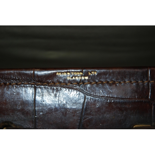 383 - Two brown leather animal skin suitcases