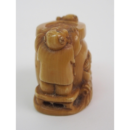 54 - A Japanese ivory netsuke of Daikoku