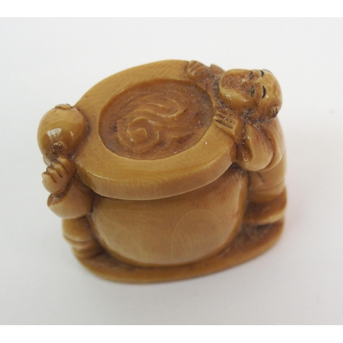 54 - A Japanese ivory netsuke of Daikoku