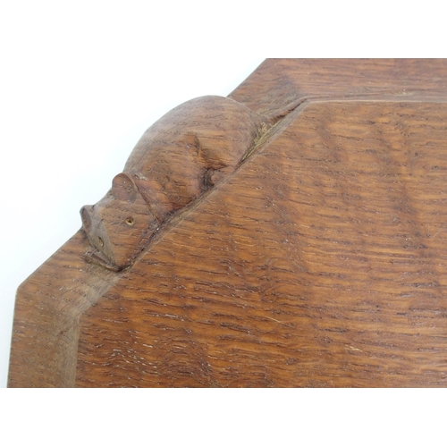 556 - A Robert Thompson of Kilburn 'Mouseman' carved oak cheese or bread board