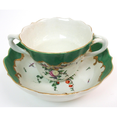 571 - An 18th Century Worcester two-handled chocolate cup and saucer