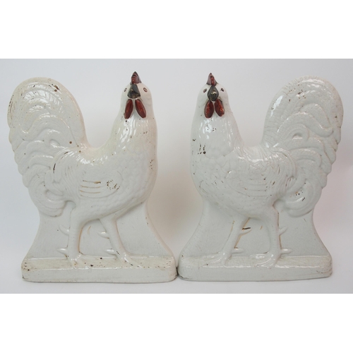 580 - A pair of late 19th/early 20th Century Staffordshire Cockerels