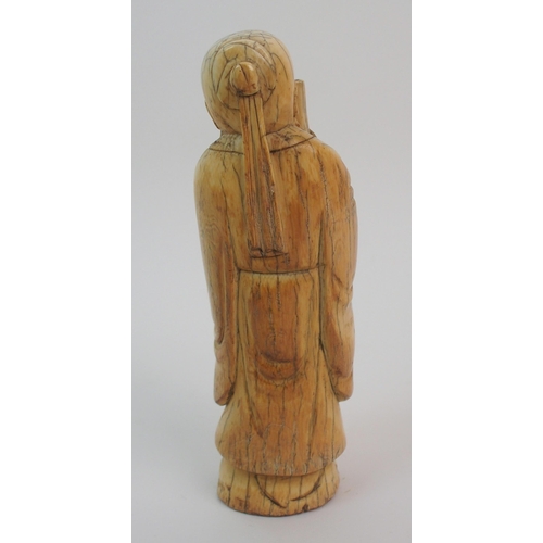 60 - A Chinese ivory figure of a scholar