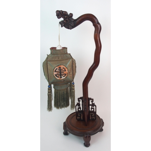 62 - A Chinese hardwood table lamp