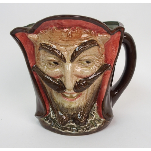 642 - A large Royal Doulton Mephistopheles double faced jug