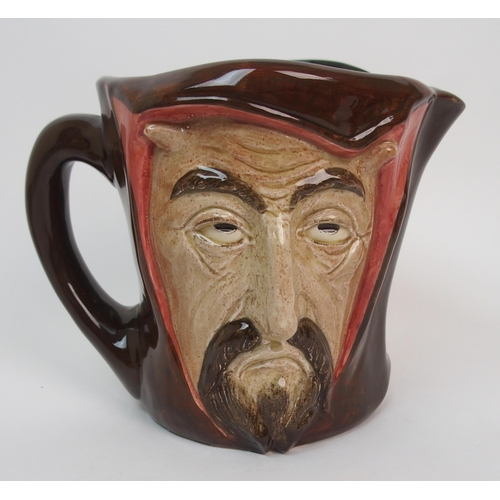 642 - A large Royal Doulton Mephistopheles double faced jug