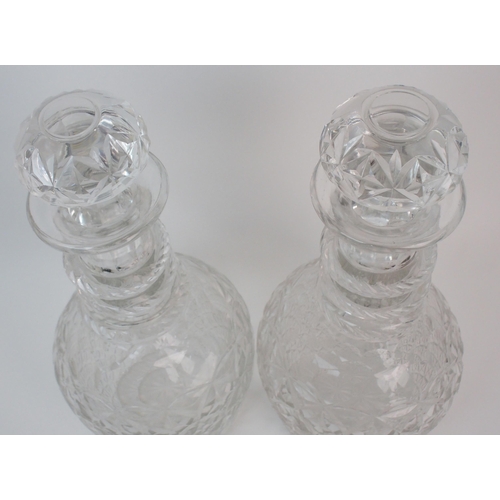 647 - A near pair of oversized Georgian style ring necked decanters