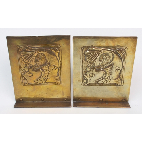 658 - A pair of Glasgow School Arts and Crafts brass bookends