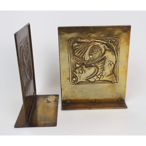 658 - A pair of Glasgow School Arts and Crafts brass bookends