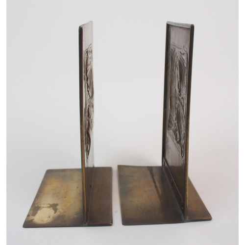 658 - A pair of Glasgow School Arts and Crafts brass bookends