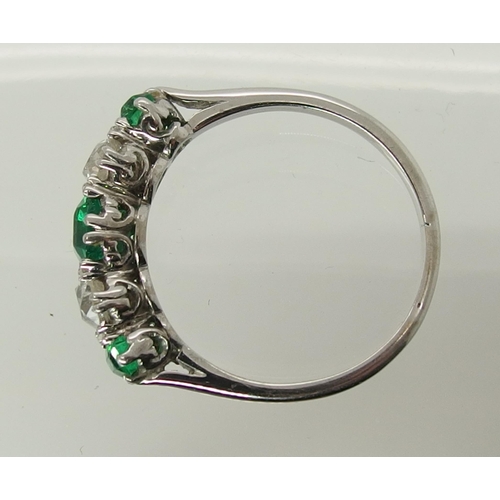 703 - A five stone emerald and diamond ring