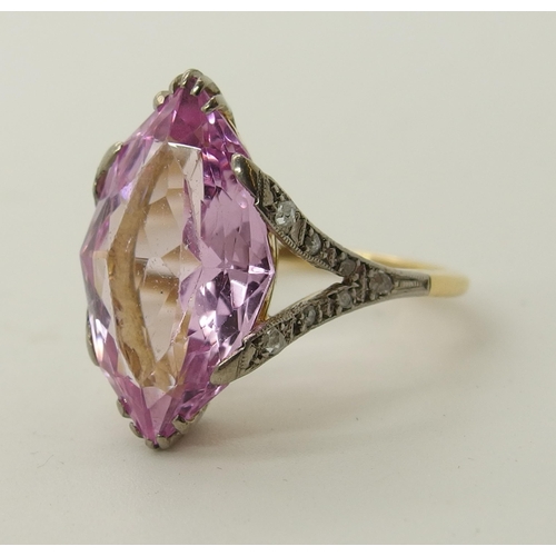 705 - An 18ct gold diamond and pink gem ring