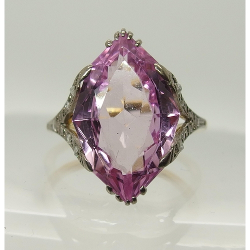 705 - An 18ct gold diamond and pink gem ring