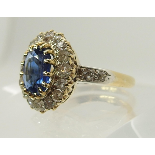 707 - A sapphire and old cut diamond cluster ring