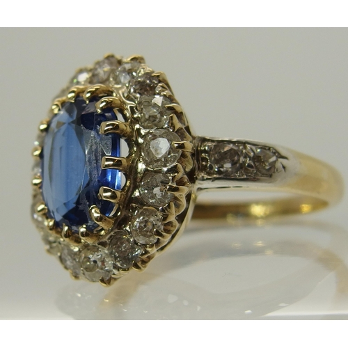 707 - A sapphire and old cut diamond cluster ring