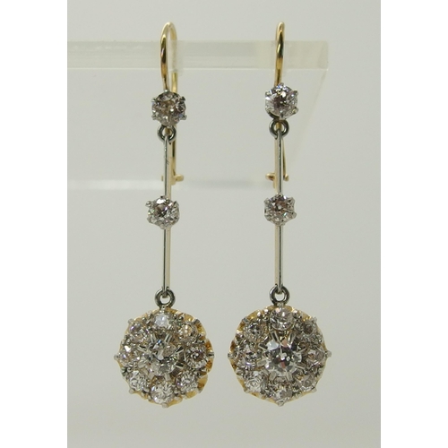 710 - A pair of diamond flower cluster drop earrings