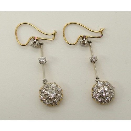 710 - A pair of diamond flower cluster drop earrings