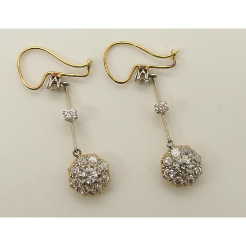 710 - A pair of diamond flower cluster drop earrings