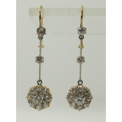 710 - A pair of diamond flower cluster drop earrings