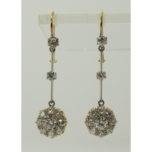 710 - A pair of diamond flower cluster drop earrings