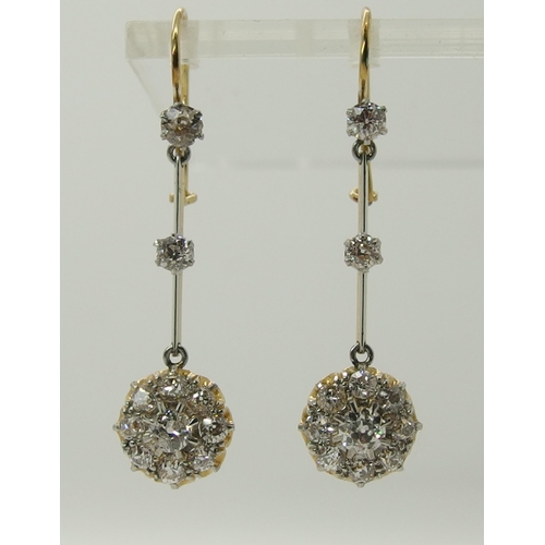 710 - A pair of diamond flower cluster drop earrings