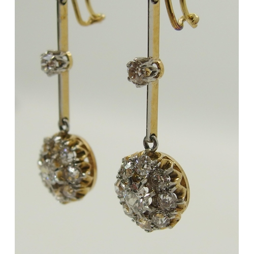 710 - A pair of diamond flower cluster drop earrings