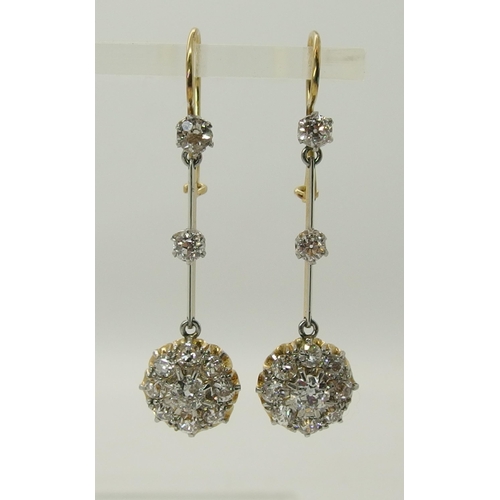 710 - A pair of diamond flower cluster drop earrings