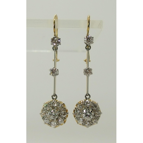 710 - A pair of diamond flower cluster drop earrings