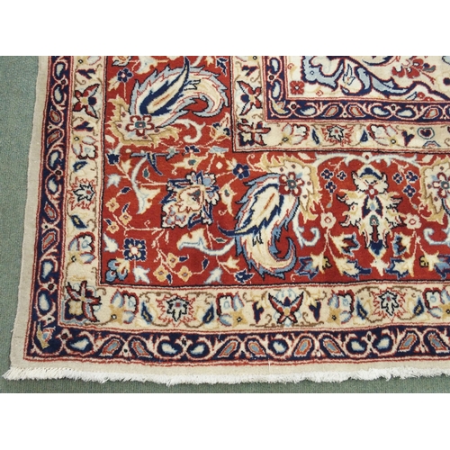 991 - An ivory ground Najaf Abad rug