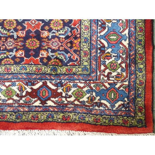 992 - A red ground fine Tabriz rug