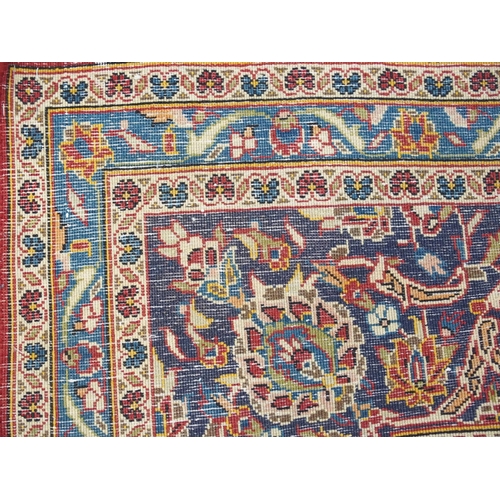 995 - A red ground Kashan rug