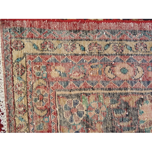 997 - A red ground Lilian rug