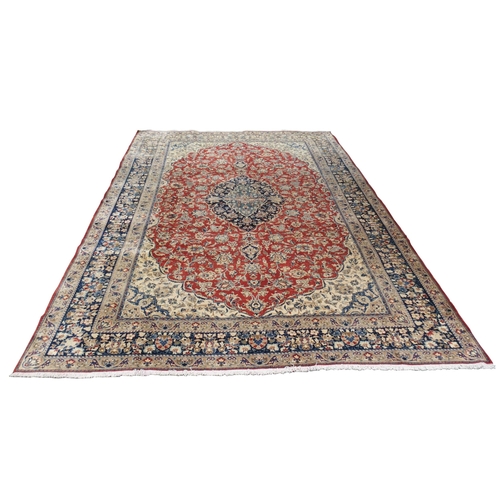 999 - A red ground Najaf Abad Rug