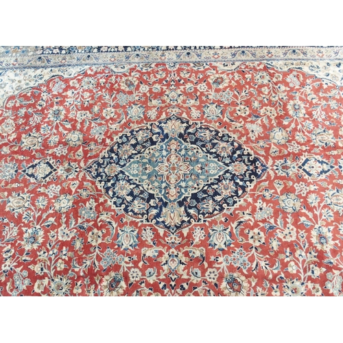 999 - A red ground Najaf Abad Rug