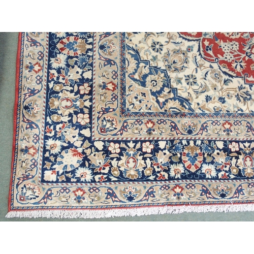 999 - A red ground Najaf Abad Rug