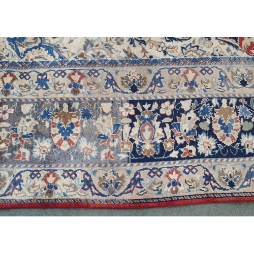 999 - A red ground Najaf Abad Rug