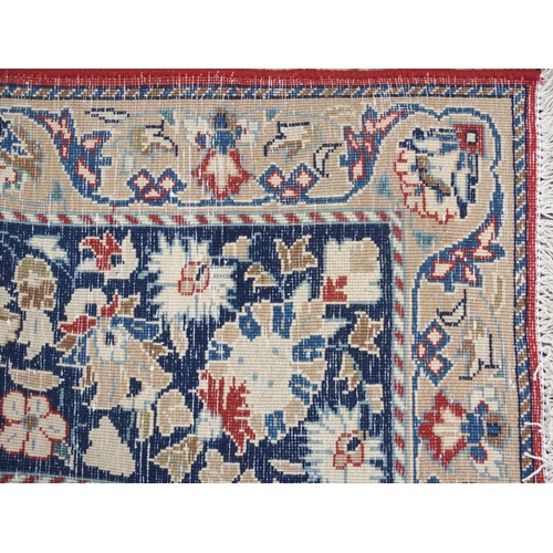 999 - A red ground Najaf Abad Rug