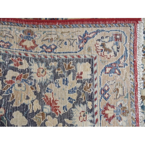 999 - A red ground Najaf Abad Rug