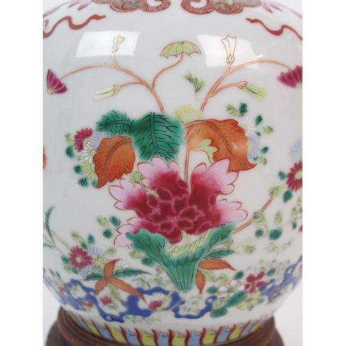 62 - A CHINESE FAMILLE ROSE JAR AND COVER