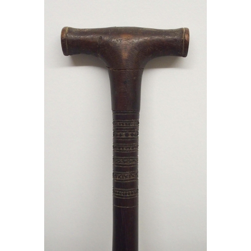 64 - A FINELY CARVED BORNEO CEREMONIAL PADDLE