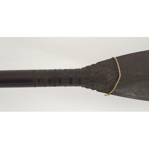 64 - A FINELY CARVED BORNEO CEREMONIAL PADDLE