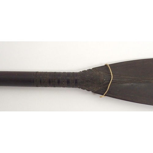 64 - A FINELY CARVED BORNEO CEREMONIAL PADDLE