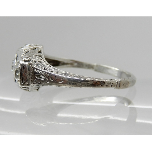 653 - A PLATINUM ART DECO STYLE DIAMOND THREE STONE RING