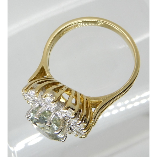 656 - AN 18CT GOLD GREEN AMETHYST AND DIAMOND CLUSTER RING